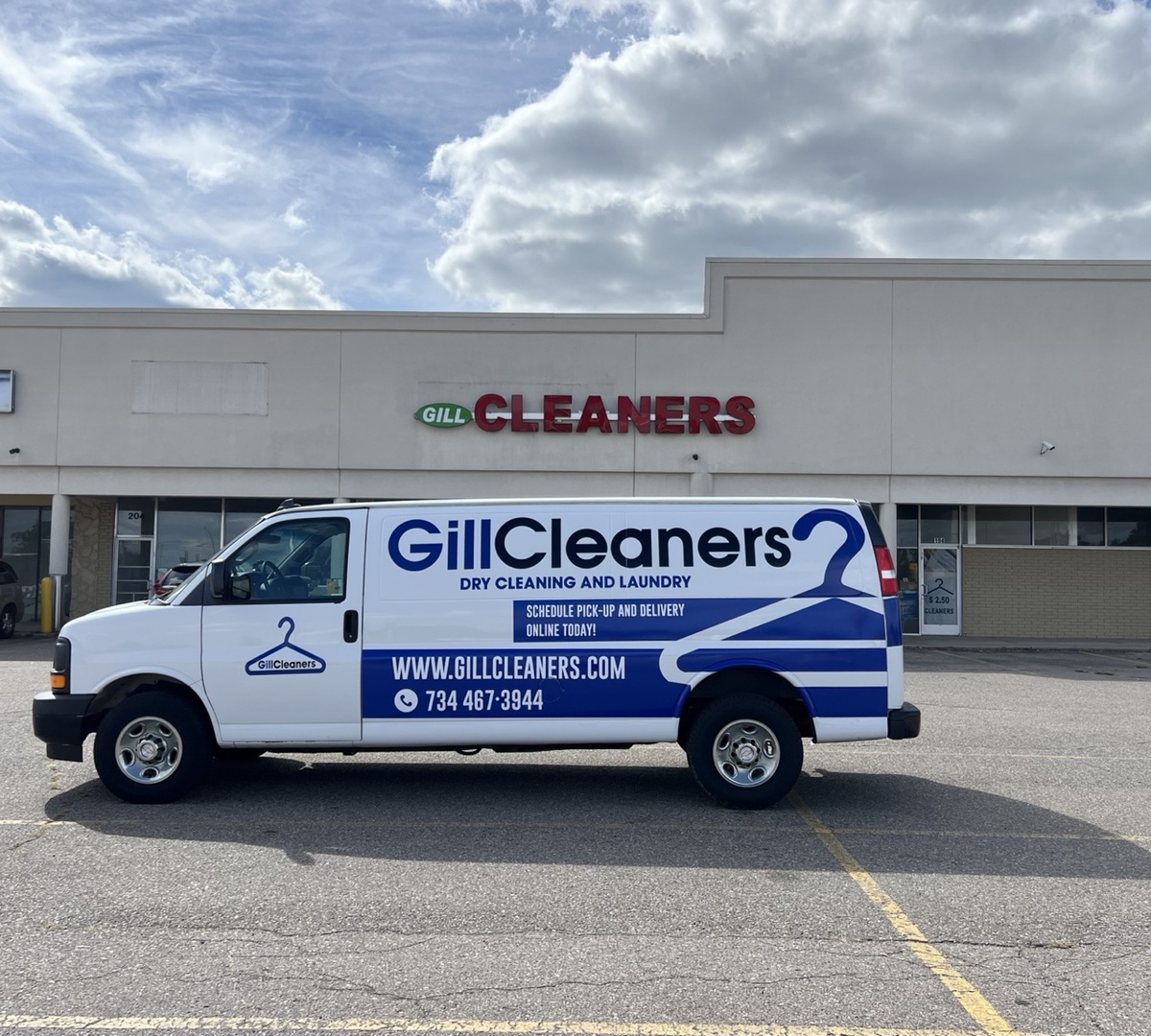 Gill Cleaners storefront and pickup and delivery van in Westland, MI